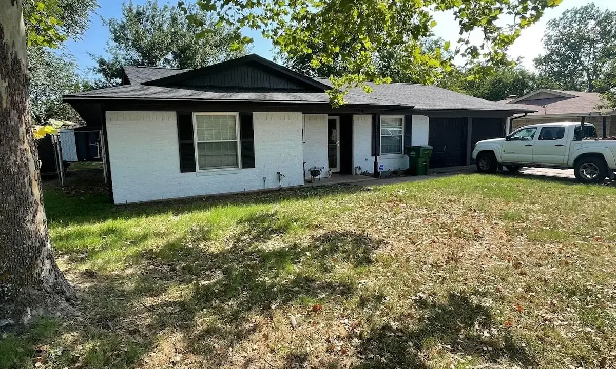 Professional roofing crew working on a residential roof in Alexander City